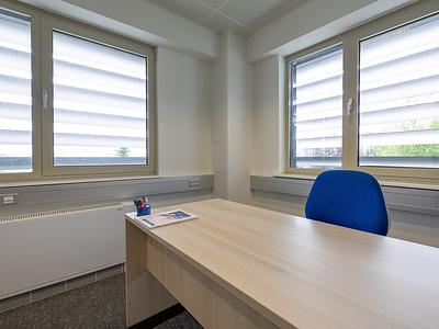 Corner furnished office on second floor with pleasant view